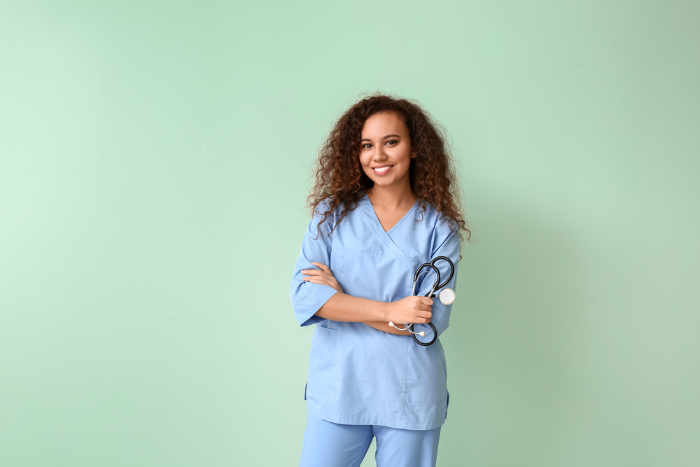 Young,African-american,Nurse,On,Color,Background